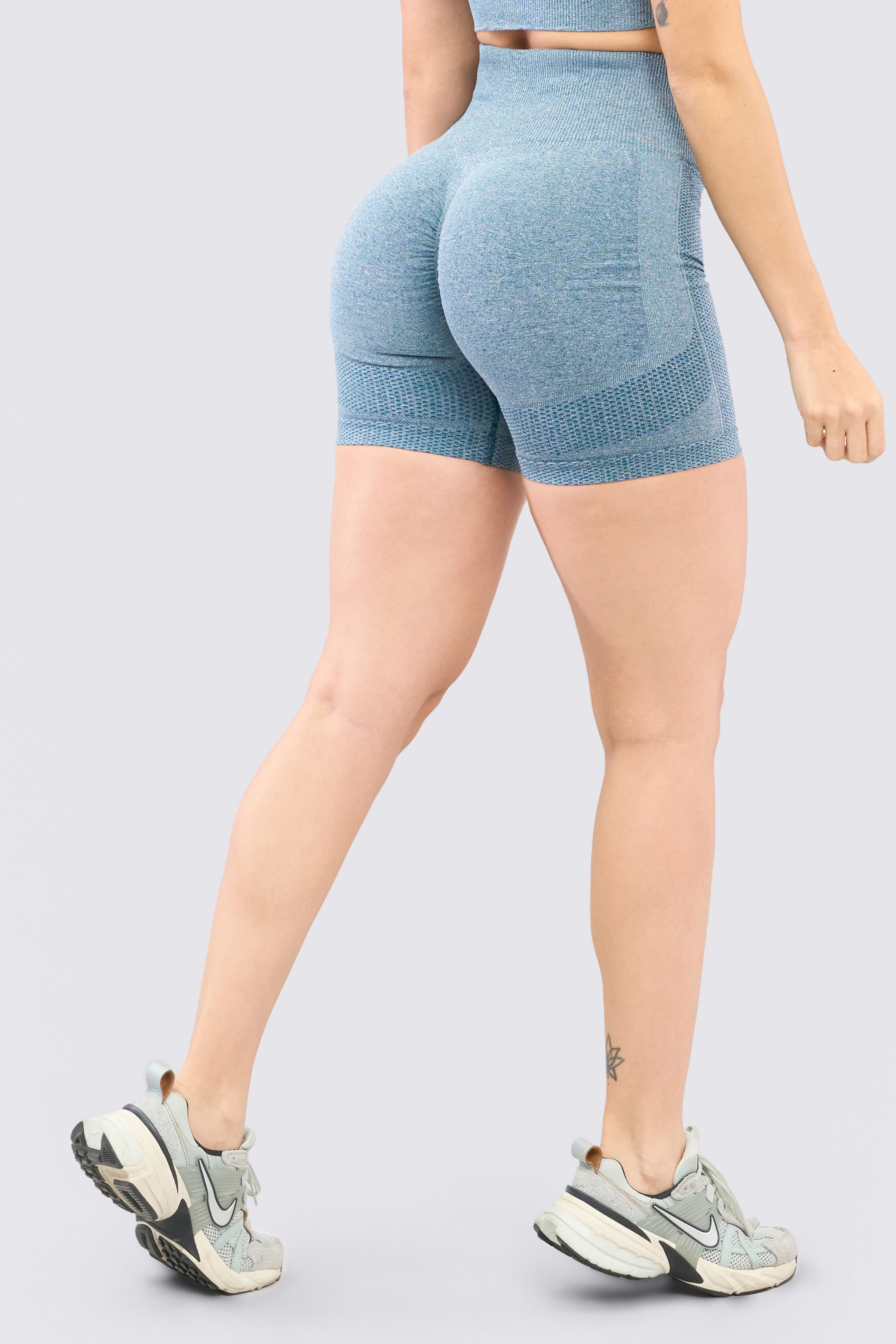 Seamless jade green sports shorts with scrunch at the buttocks, high waist, and compression. 
