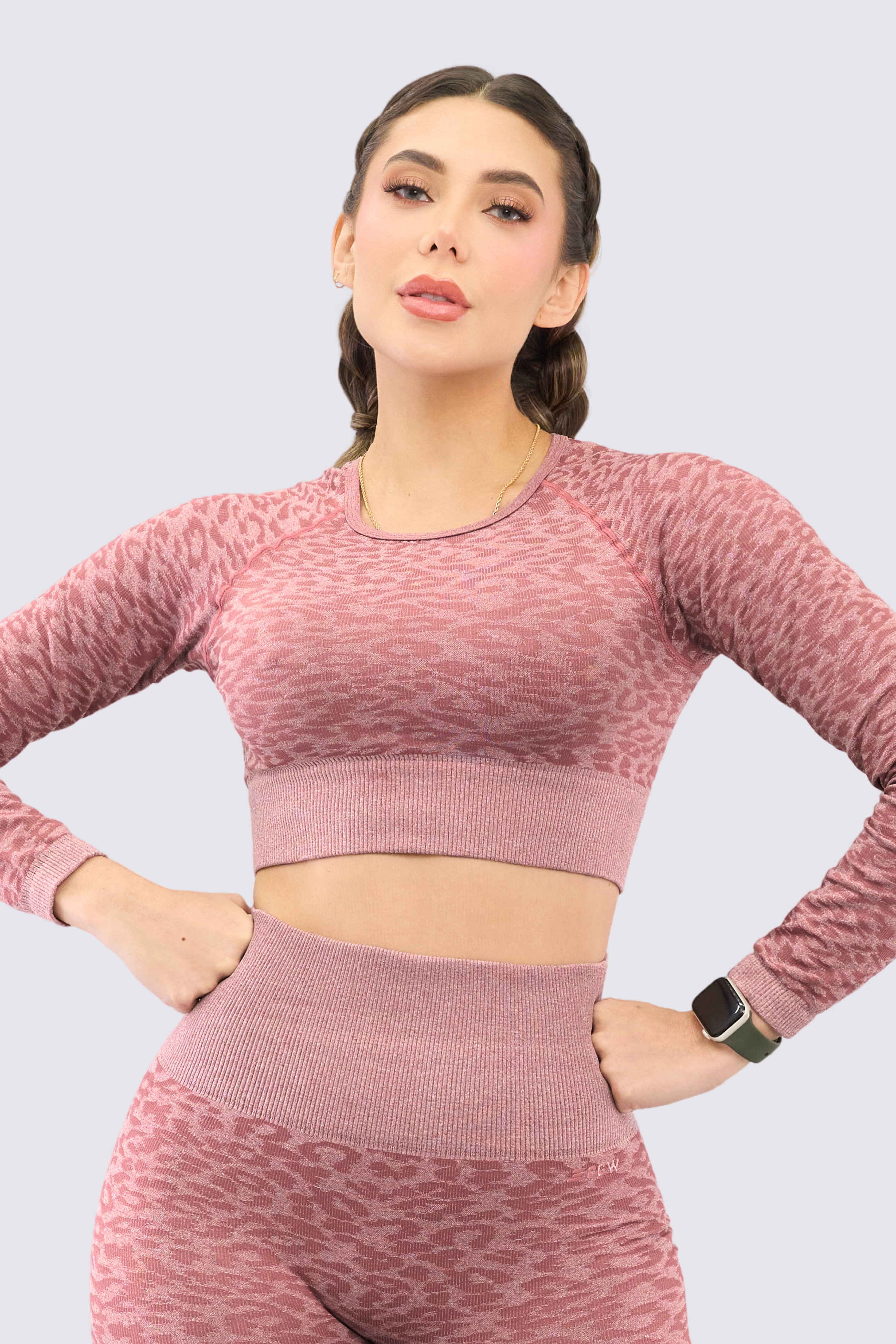 Long-sleeved jumpsuit with rosewood-colored animal print pattern. 