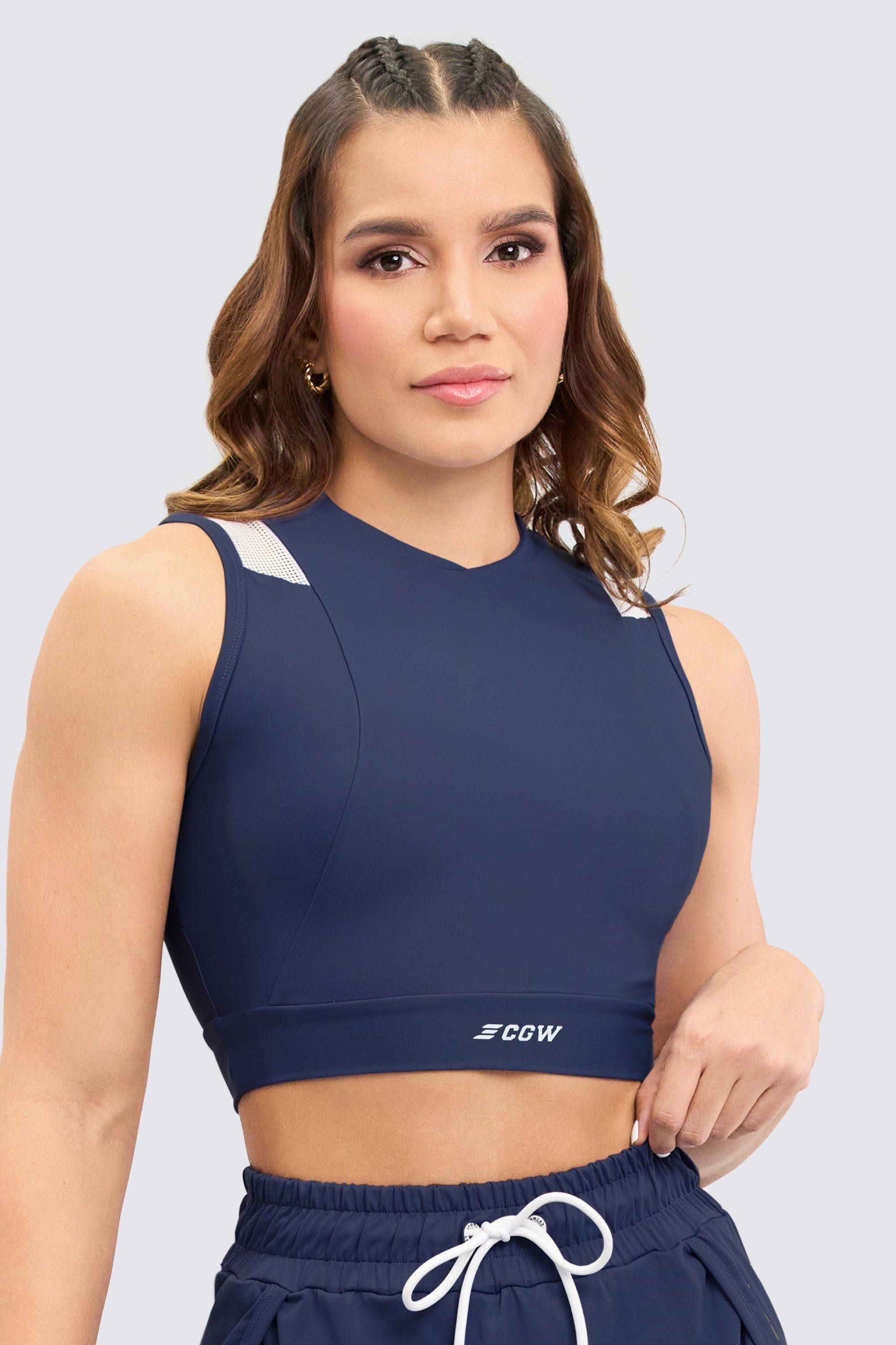 Blue sporty crop top, with mesh panels on the shoulders, soft and elastic texture design. 