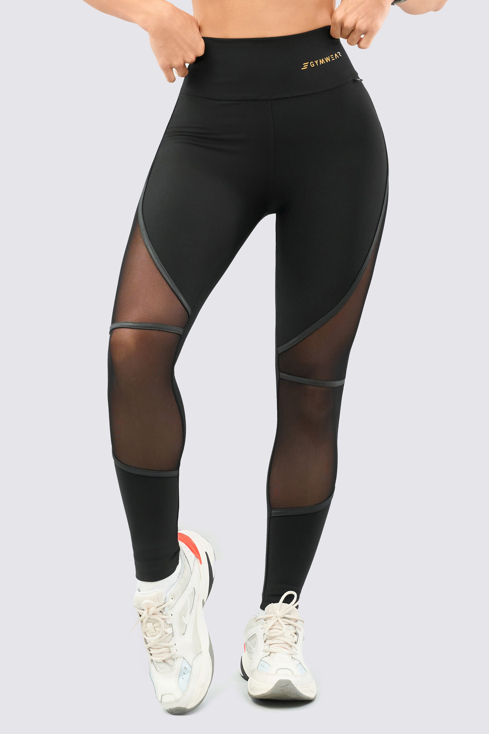 Black leggings, with mesh panels for breathability.