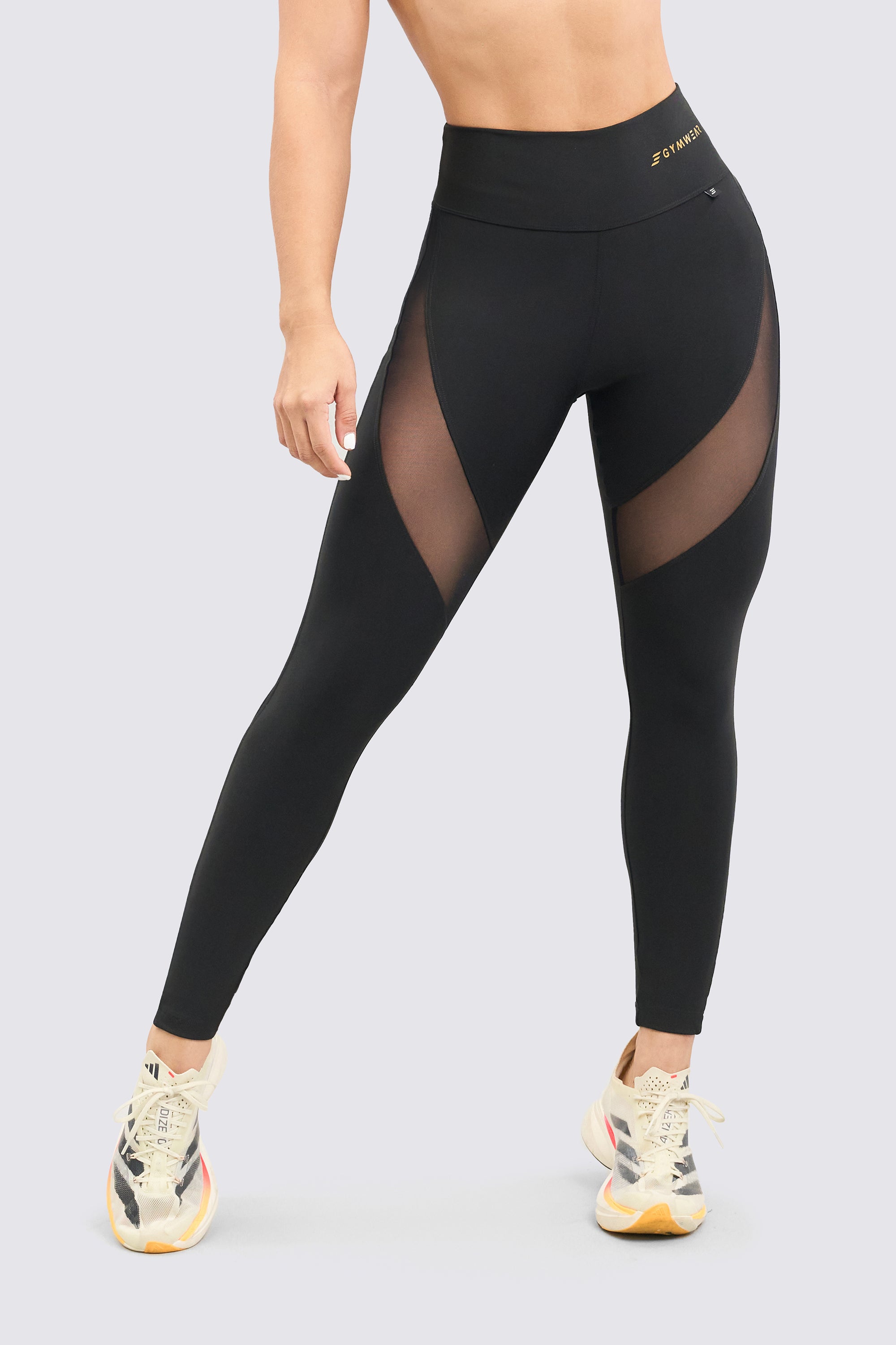 Black sports leggings with mesh panels, soft and comfortable for any sporting activity.